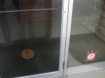 The front doors which have the only markings that indicate this was once the headquarters of Burger Chef.